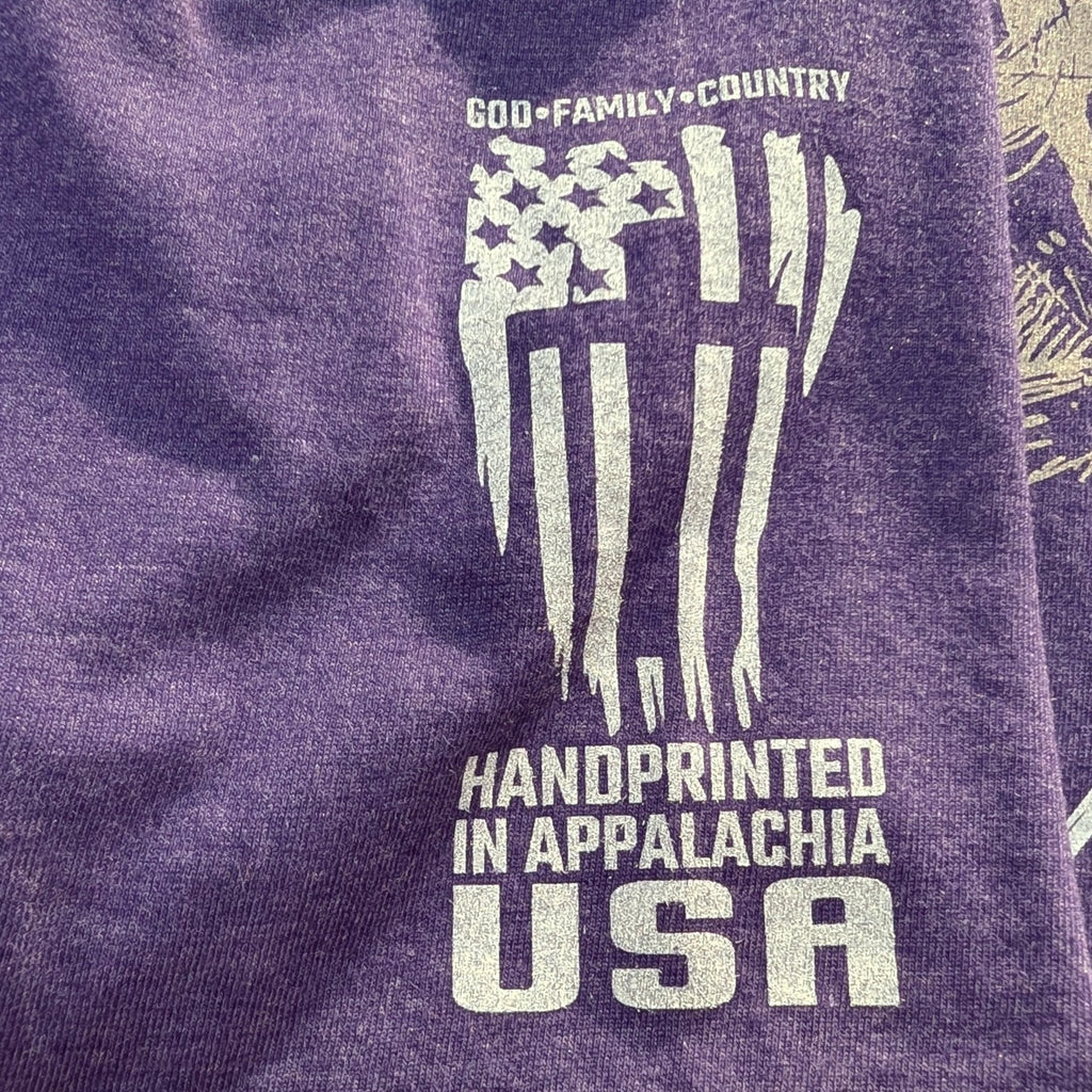 The "Day 41" Premium Graphic Tee - Meridian EDC | Laserworks - Purple shirt with white text and graphics, including an American flag design.