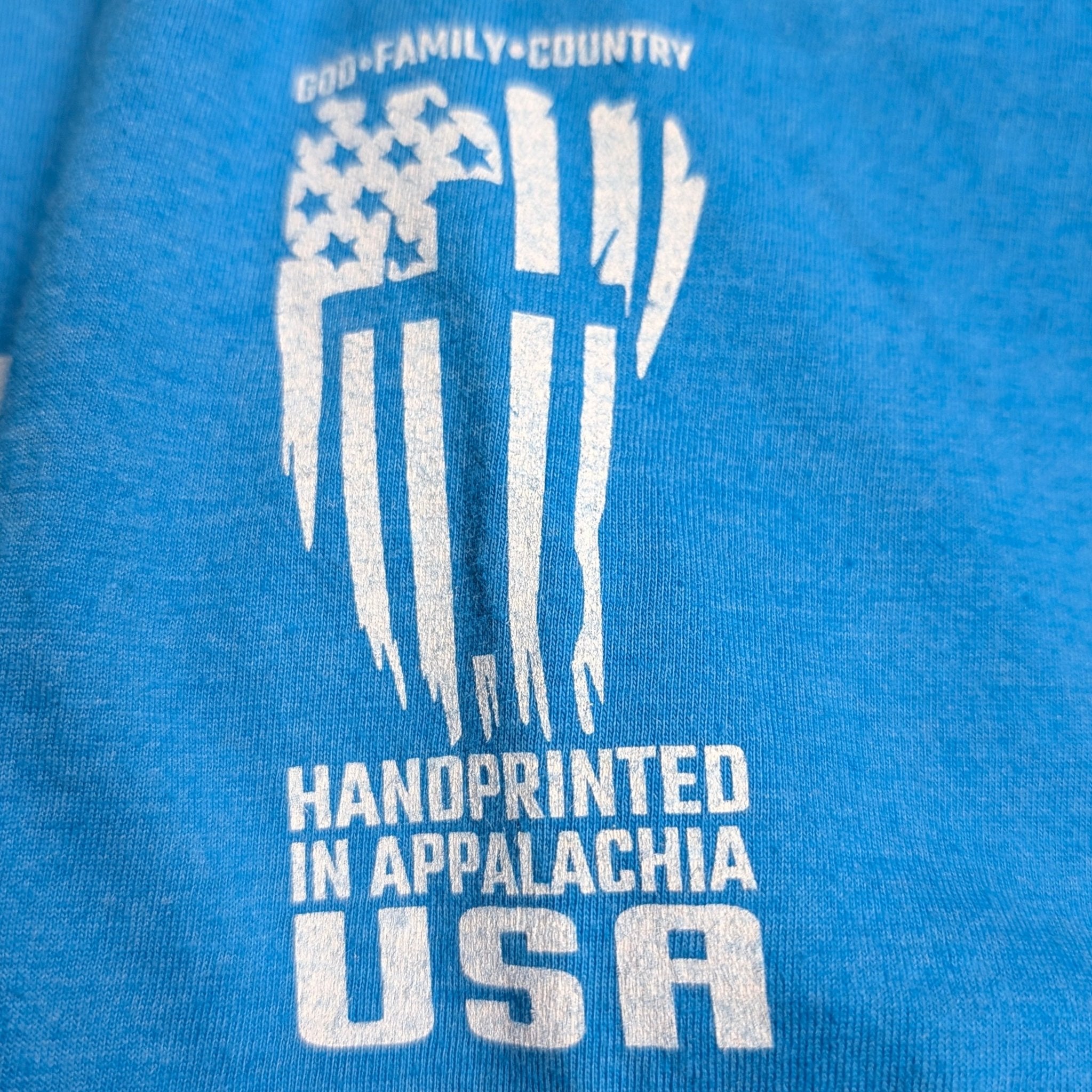 The "Iron & Grace" Premium Graphic Tee - Meridian EDC | Laserworks - Blue t-shirt with white graphic and text on a blue background