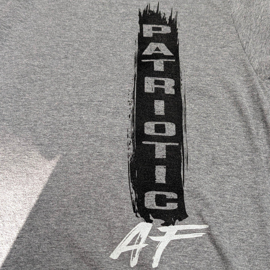 The "Patriotic AF" Premium Graphic Tee - Meridian EDC | Laserworks - Gray t-shirt with 'Patriotic AF' text design on a plain background